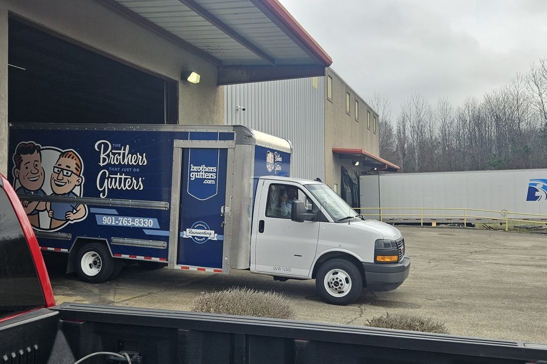 The box truck heading out of the shop for a job