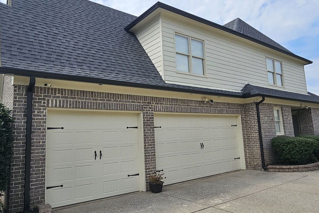 Finished gutters on a two-story home with a three-car garage