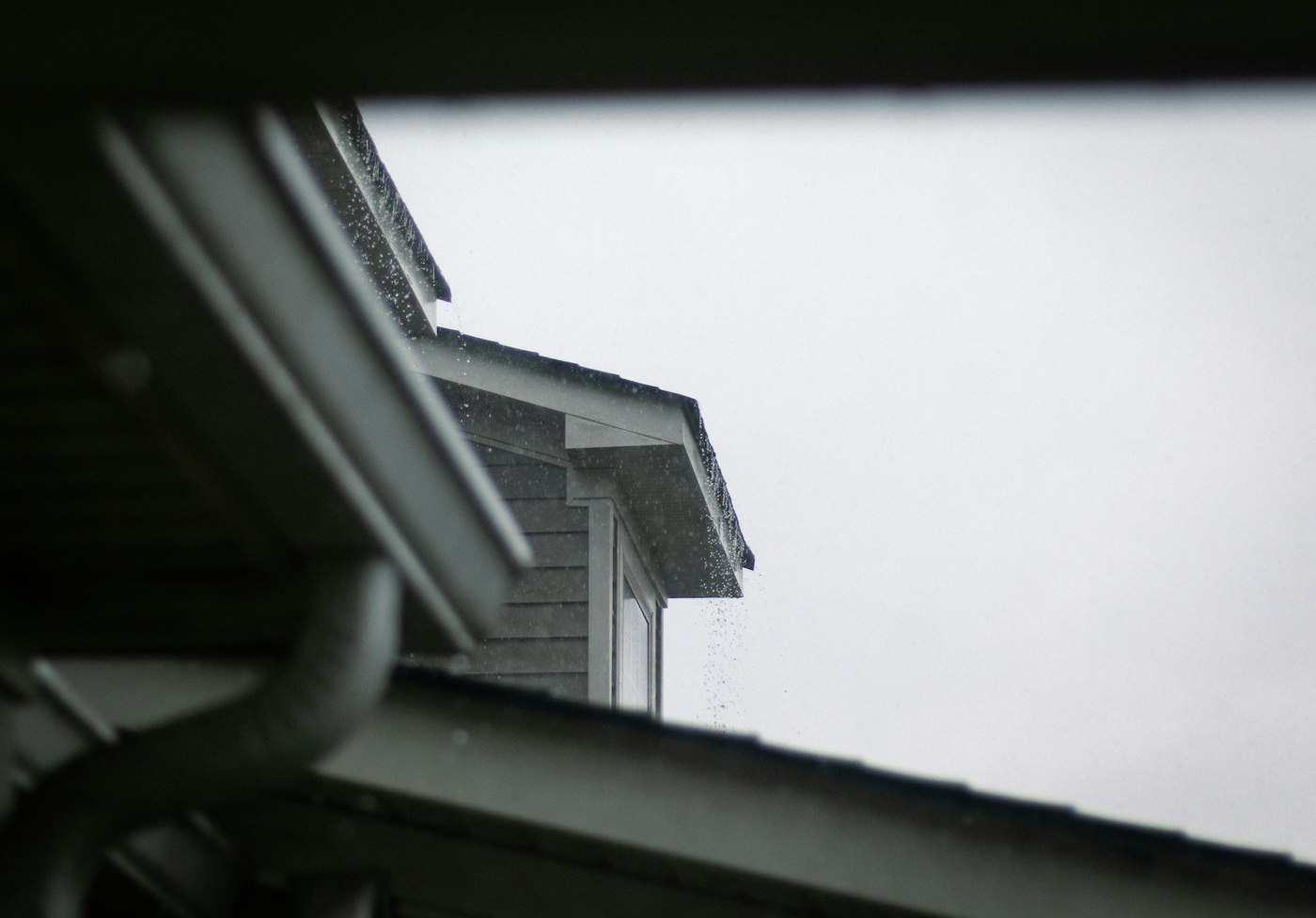 Rain running off a roofline during a storm
